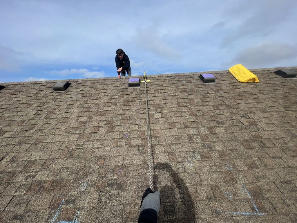 Photo of a Nashville roofers during a roof inspection.