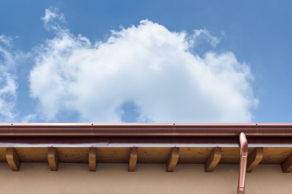 Upclose photo looking up at new Gutters on a home