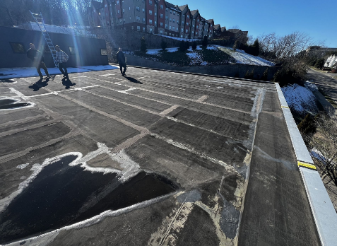 rofers on a commercial flat roof during commercial roof inspection