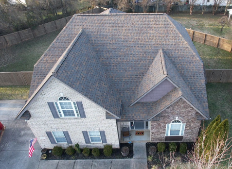 Top down Image of a house with newly installed brown shingled roof