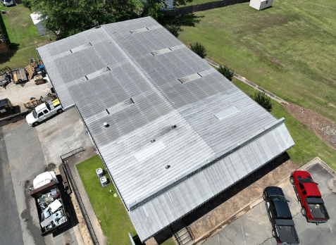 Overhead Image of a metal roof before a commercial roof replacement