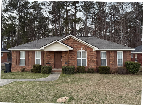 Image of brick residential house with a new shingle roof