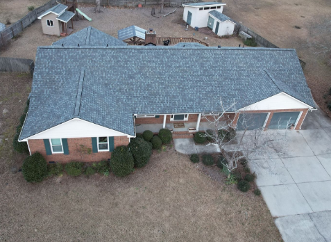 Top down Image of a house with newly installed gray shingled roof