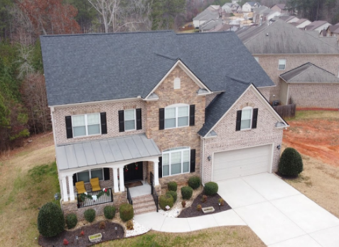 Image of residential house with a new gray shingle roof in Powder Springs