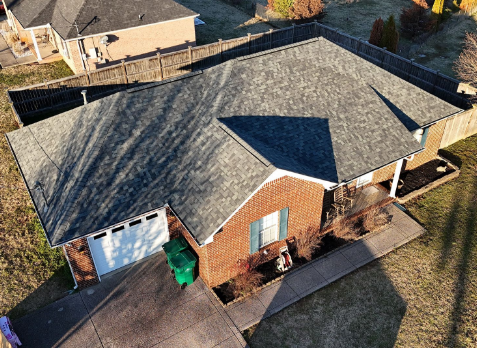 Top down Image of a house with newly installed gray shingled roof in Powder Springs