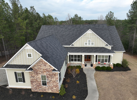 Top down Image of a house with newly installed gray shingled roof
