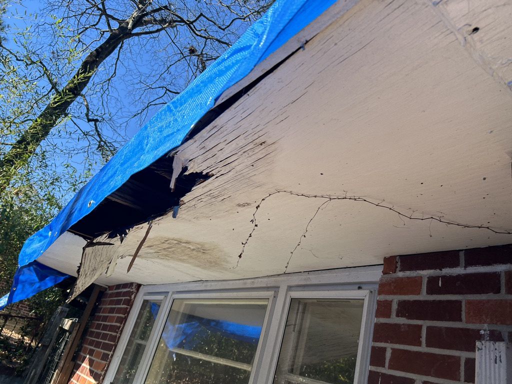 Damaged roof in Georgia in need of roofing services