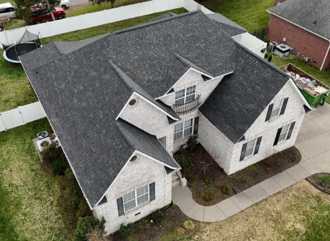 Image of residential house with a new gray shingle roof in Greenbrier Tennessee