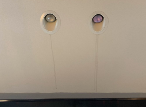 Image of a roof leak stain on the ceiling of a roof