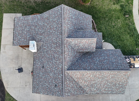 Top down image of a newly replaced gray asphalt shingled roof