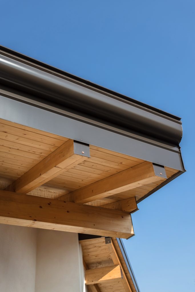 Rain gutter with drip edge on the roof ecological house