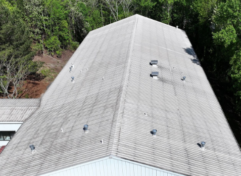 Overhead Image of a metal roof before a commercial roof replacement
