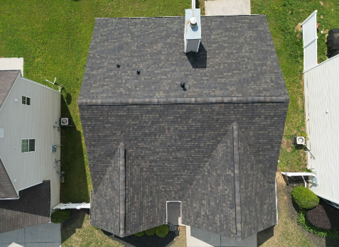 Image of a house with newly installed shingled roofing in Green Hill.