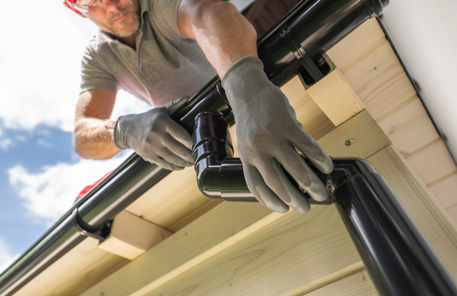 Photo of a roofer installing Gutter