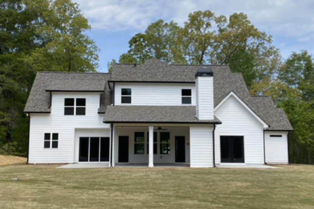 Back of a white house after a gutter replacement