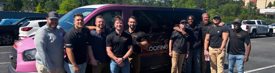 Whitaker Roofing Company group photo in front of roofing truck