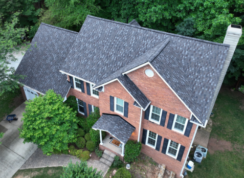 Image of residential house with a new gray shingle roof in Woodstock Georgia