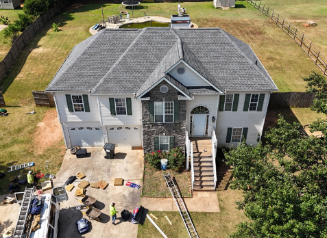 Image of a new gray asphalt shingled roof replacement on a house.