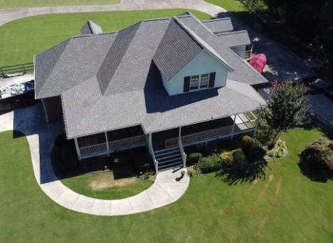 Drone Image of a house with newly installed light gray shingled roof.