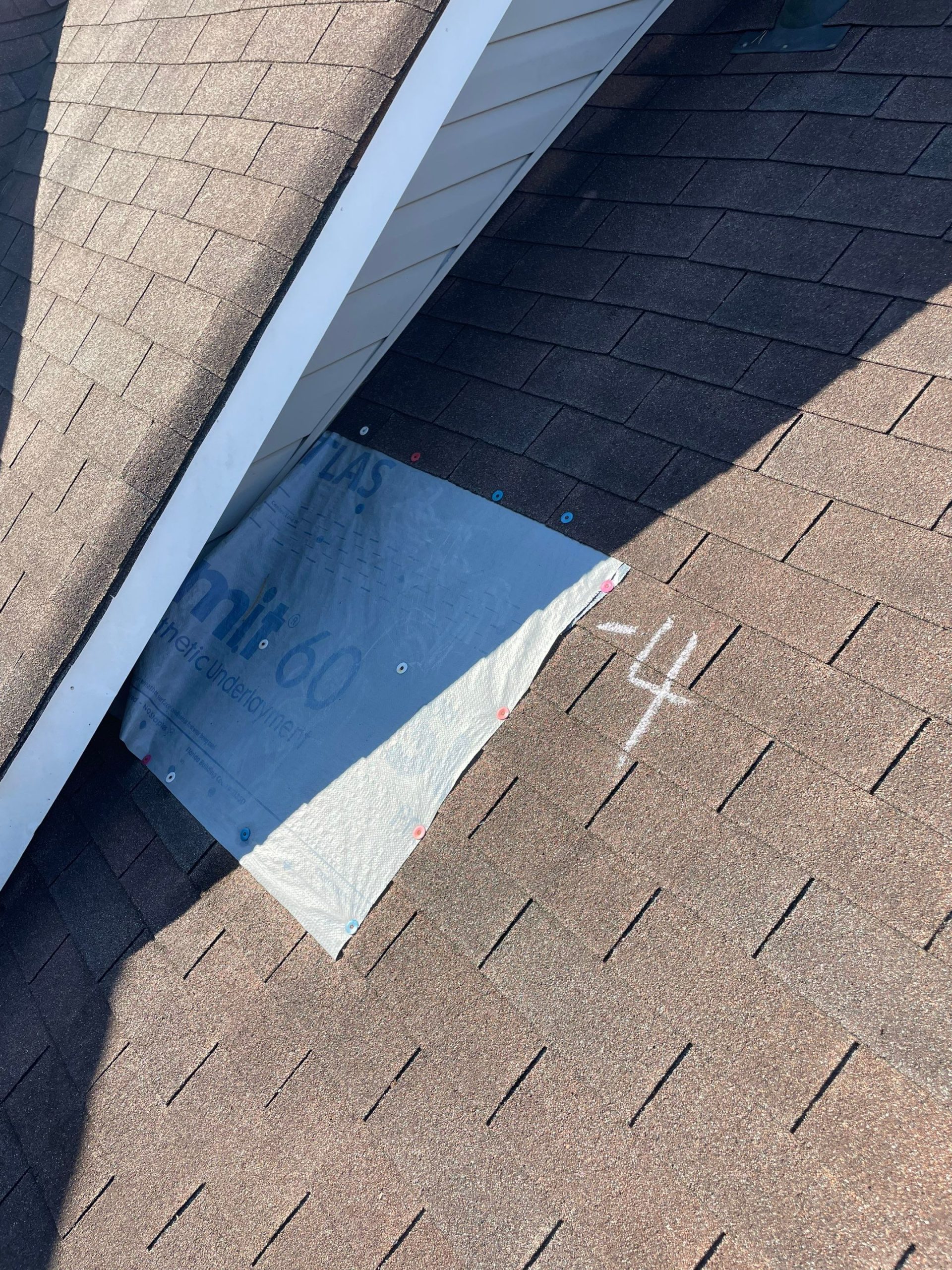 Photo of roof with tarp needing roof repair in birmingham