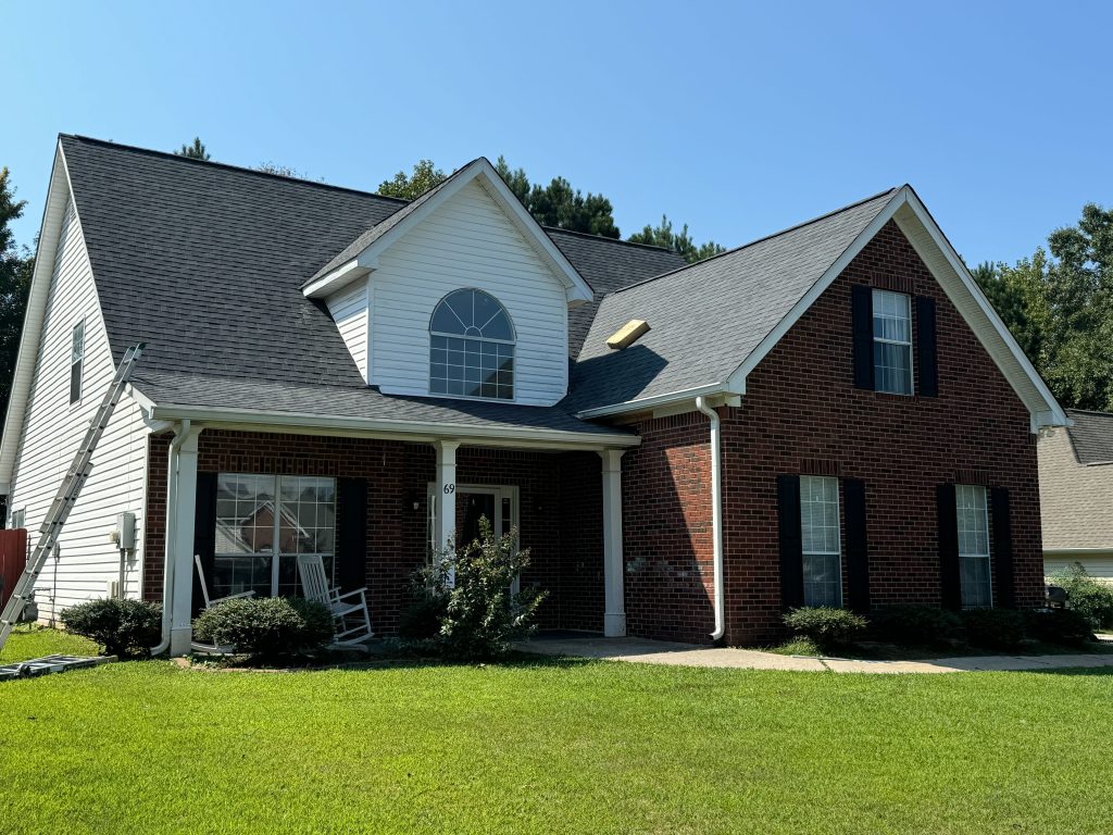 Drone image of a new roof replacement with asphalt shingles.