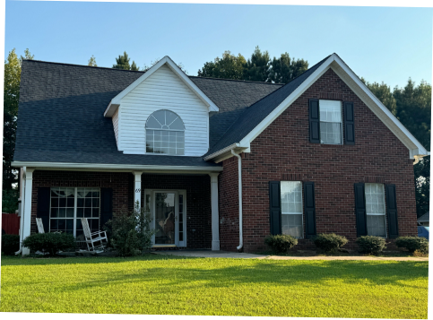 Image of a brick house with a new residential roofing in Fairburn