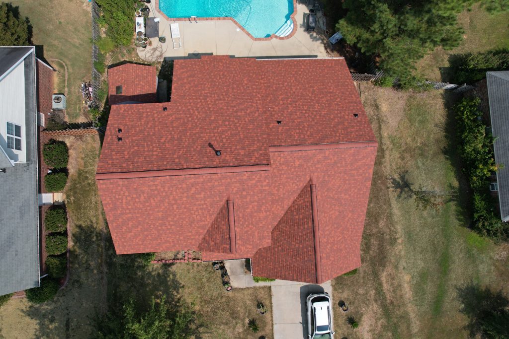 Drone image of a new roof replacement with Owens Corning terra cotta asphalt shingles.