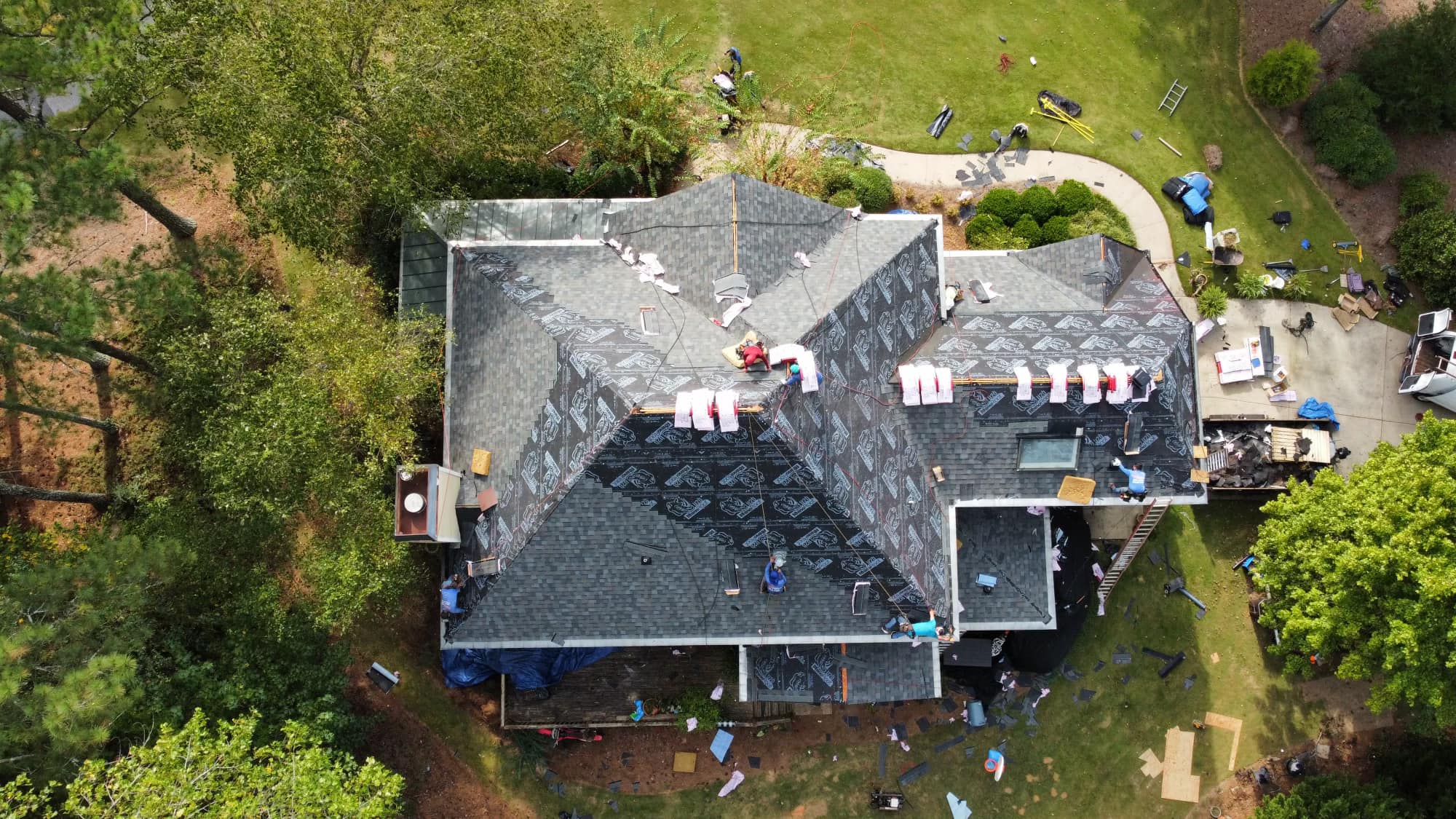 Top down drone image of a roof replacement in progress by the top rated roofing contractor