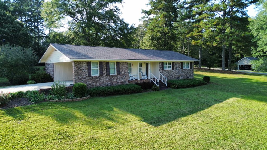 Image of a new roof replacement with top roofing shingles.