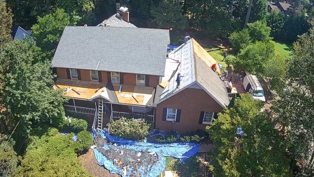 Image of a roof being replaced after wind damage