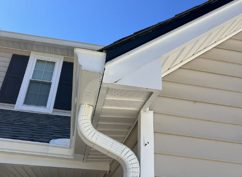 Up close image of a new gutters installed on a house