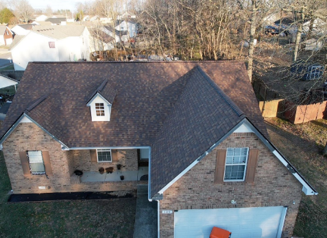 Drone Image of a house with newly installed brown shingled roof