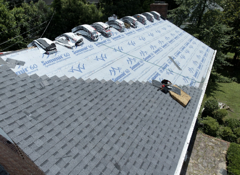 Overhead Image of a gray shingle roof during residential roof replacement